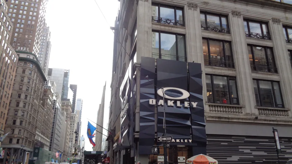 The Oakley store at West 46th Street and Fifth Avenue in Midtown Manhattan, with the Oakley logo on a dark facade above the entrance