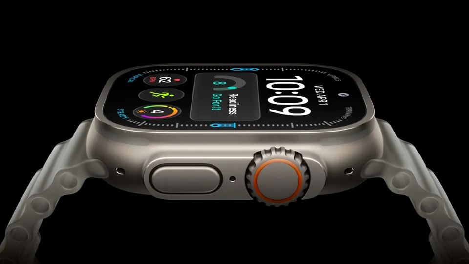 Apple Watch Ultra 4 in natural titanium with an orange-ringed Digital Crown and the Action button, on a black background, with a watch face showing 10:09 and a Readiness card