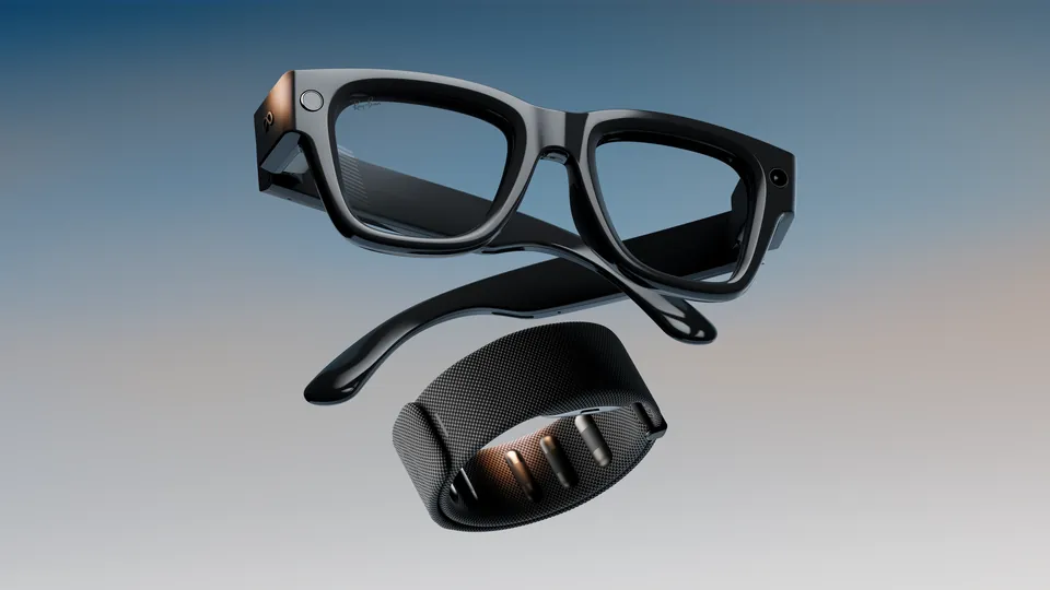 Black Meta Ray-Ban Display glasses floating above a dark mesh Meta Neural Band against a blue-to-gray gradient background