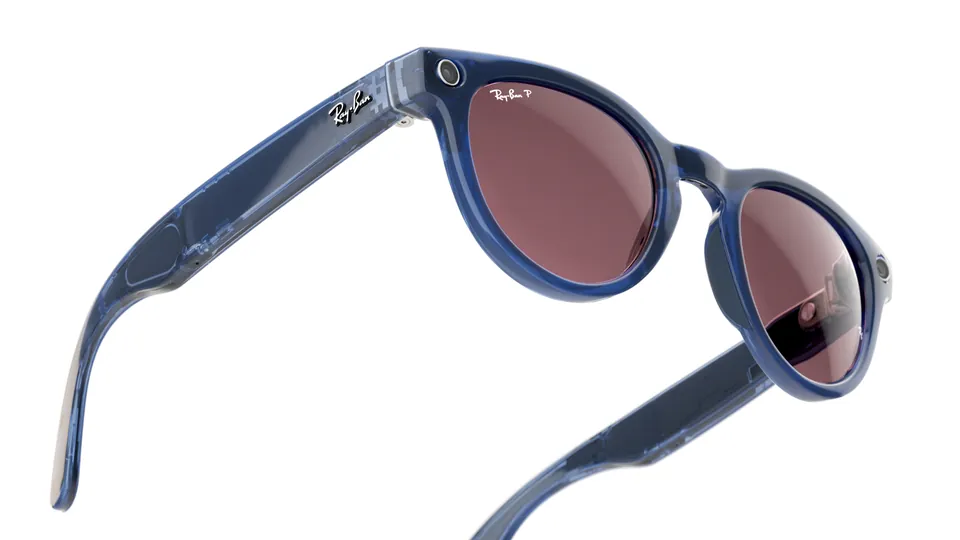 Ray-Ban Meta Headliner glasses with a blue translucent frame and rose-tinted lenses, shown at an angle on a white background