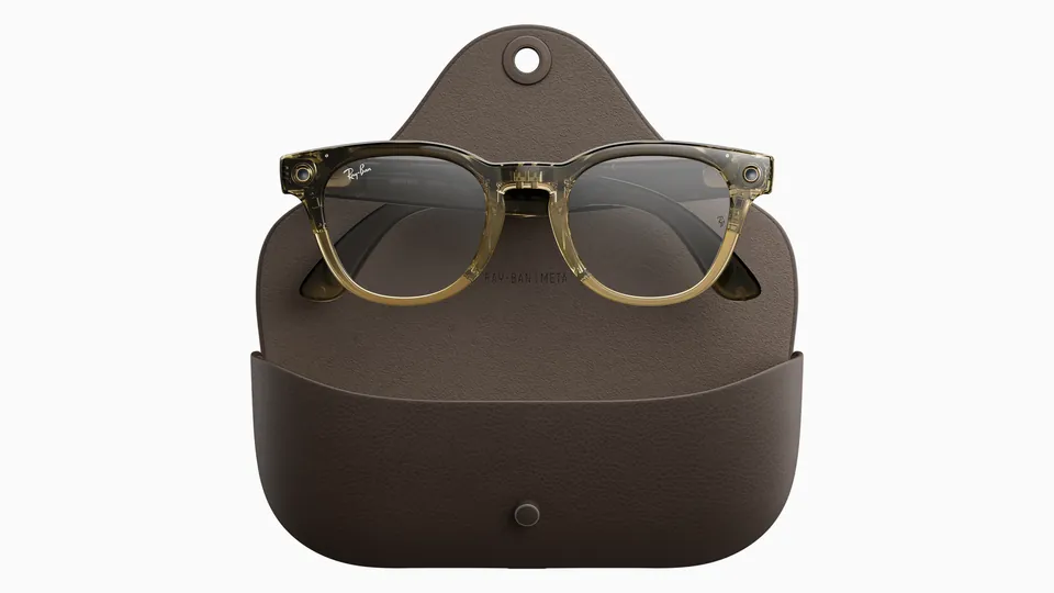 Olive-and-clear Ray-Ban Meta glasses resting on the open flap of a brown leather charging case on a white background
