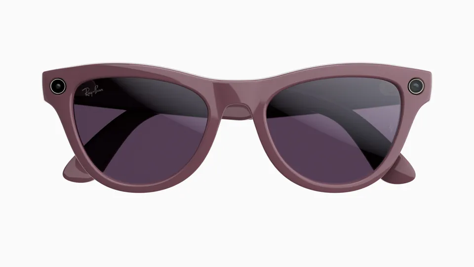 Front view of Ray-Ban Meta Skyler glasses in a dusty violet frame with dark purple lenses and a camera at each corner, on a white background
