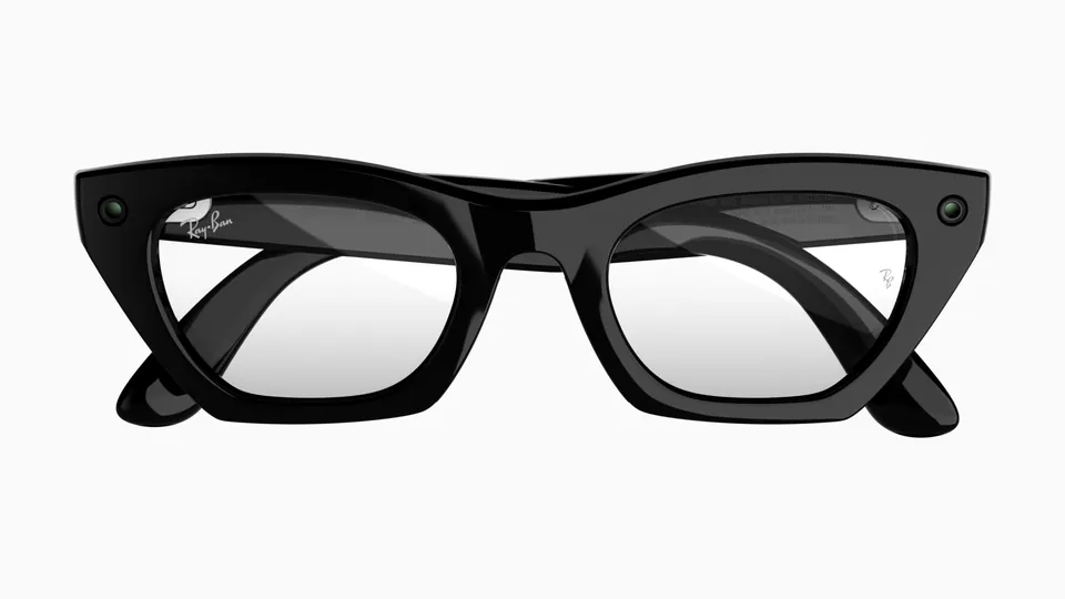 Front view of Ray-Ban Meta Zena glasses in a glossy black cat-eye frame with clear lenses and a small round lens at each outer corner, on a white background