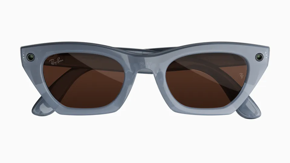 Front view of Ray-Ban Meta Zena glasses in a milky gray-lilac cat-eye frame with copper-brown lenses and a small round lens at each outer corner, on a white background