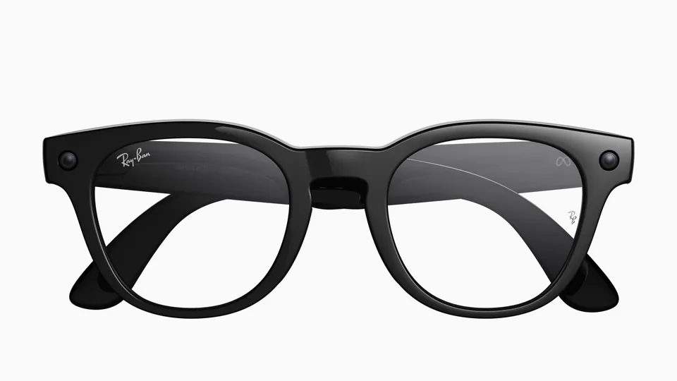 Ray-Ban Scriber Optics glasses with a glossy black round-square frame and clear lenses, a camera on each side, on a white background