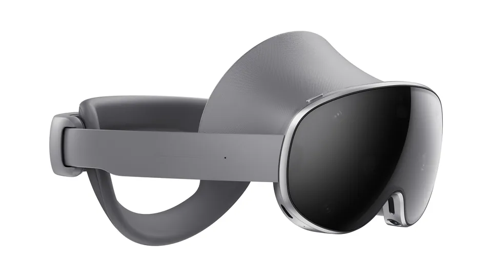 Three-quarter view of the Samsung Galaxy XR headset, with a gray fabric headband and a dark curved visor edged in silver, on a white background
